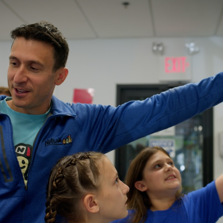 Nuts.com staff member with two children