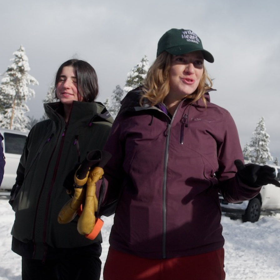 Wild Hearts Idaho staff members in a snowy landscape