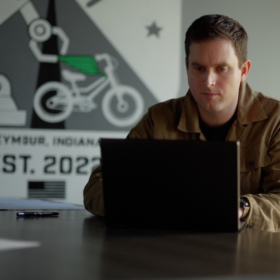 Guardian Bikes staff member working in the office