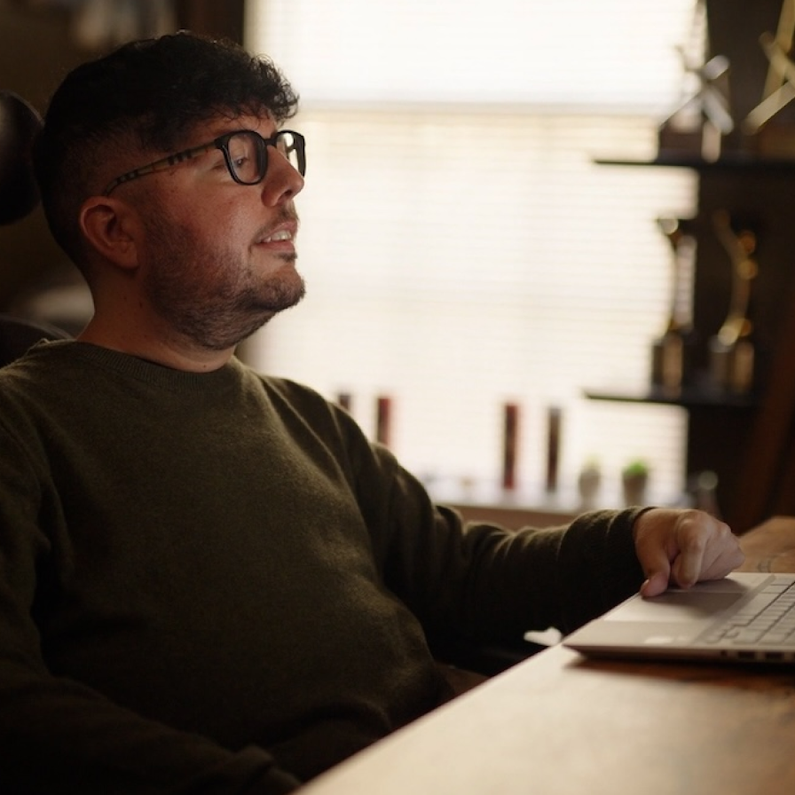 Cory from Curb Free with Cory Lee working on a computer