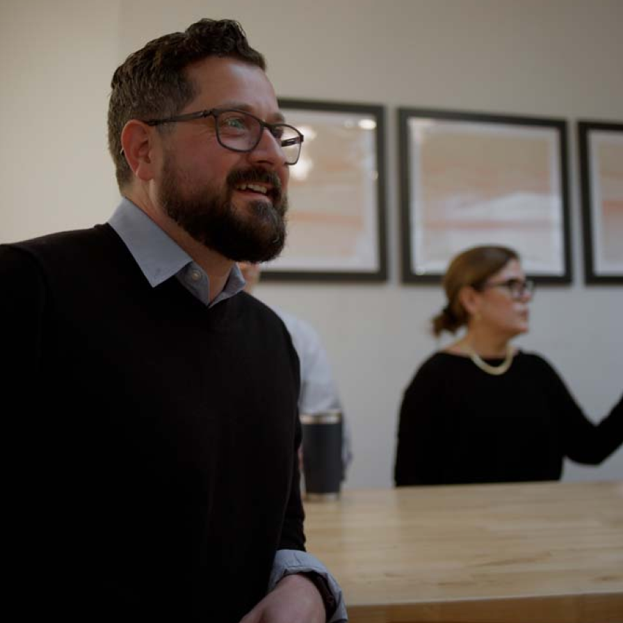Joe the Architect team members in the office