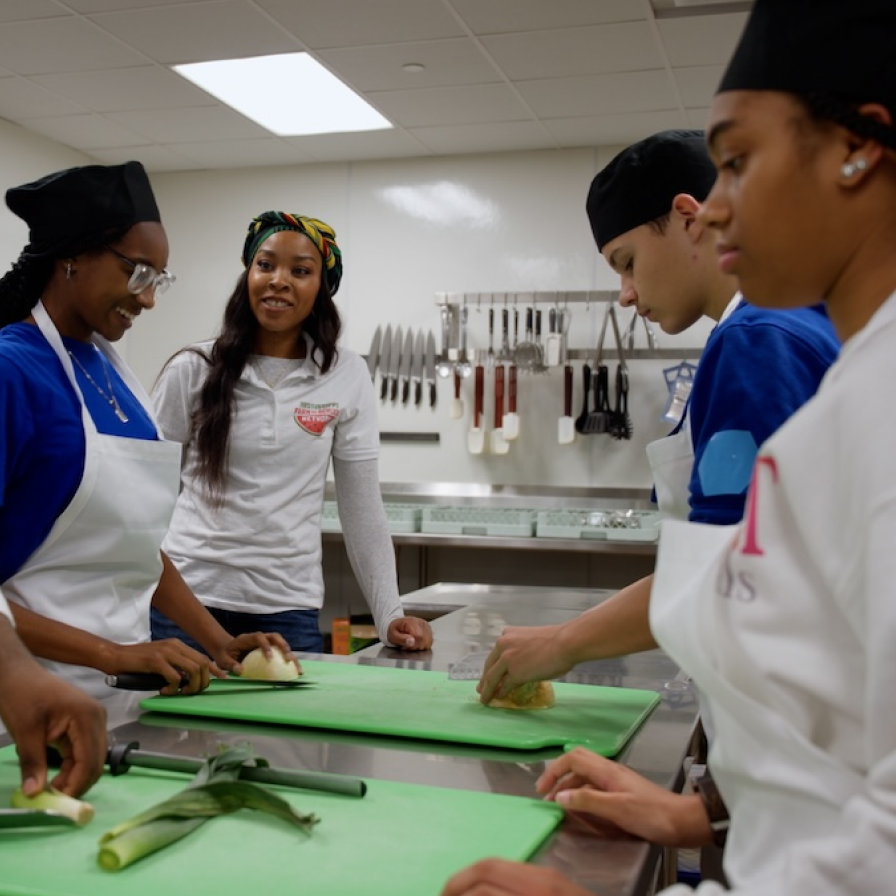 Mississippi Farm to School Network participants in a commercial kitchen