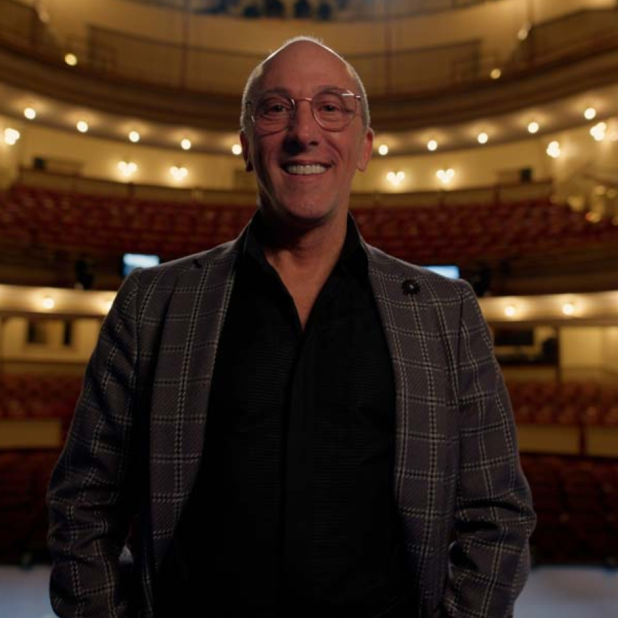 A man standing on The Fulton Theatre stage